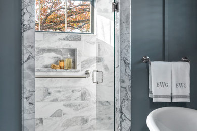 Inspiration for a mid-sized country master marble tile marble floor and single-sink bathroom remodel in St Louis with flat-panel cabinets, dark wood cabinets, a two-piece toilet, blue walls, an undermount sink, marble countertops, a hinged shower door, a niche and a floating vanity