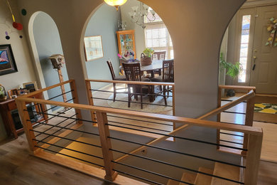 Example of a mid-century modern staircase design in Other