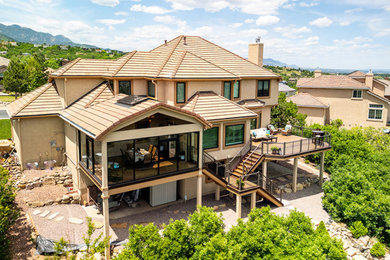 Large elegant two-story house exterior photo in Other