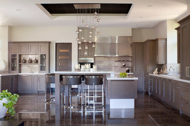 Example of a large transitional u-shaped marble floor open concept kitchen design in Denver with an undermount sink, recessed-panel cabinets, gray cabinets, quartzite countertops, beige backsplash, porcelain backsplash, paneled appliances and an island