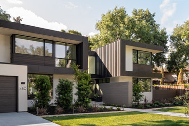 Contemporary beige two-story metal flat roof idea in San Francisco
