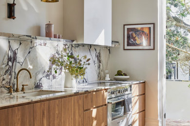 This is an example of a mid-sized transitional galley separate kitchen in Sydney with an undermount sink, flat-panel cabinets, brown cabinets, marble benchtops, multi-coloured splashback, marble splashback, stainless steel appliances, light hardwood floors, no island, brown floor, multi-coloured benchtop and coffered.