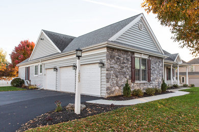 Example of a large classic white one-story wood exterior home design in Other with a shingle roof