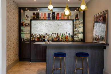 Inspiration for a medium sized modern wet bar in Other with a submerged sink, flat-panel cabinets, laminate countertops, mirror splashback and grey worktops.