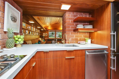 Inspiration for a small modern u-shaped ceramic tile and brown floor enclosed kitchen remodel in San Francisco with an undermount sink, flat-panel cabinets, medium tone wood cabinets, quartz countertops, brown backsplash, brick backsplash, stainless steel appliances, no island and white countertops