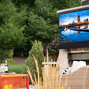 Patio with outdoor gas fireplace and waterproof TV with soundbar