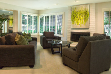 This is an example of a mid-sized contemporary formal enclosed living room in Sacramento with white walls, carpet, a standard fireplace, a metal fireplace surround and no tv.