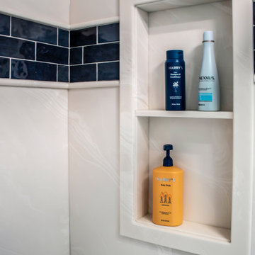 Primary Bathroom with Blue-Gray Vanity and Deep Blue Tiled Feature Wall