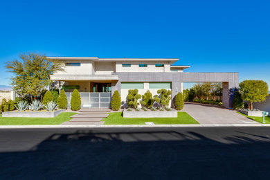 Inspiration for a huge modern two-story house exterior remodel in Las Vegas