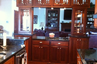 Family room - mid-sized traditional open concept medium tone wood floor family room idea in Cincinnati with white walls