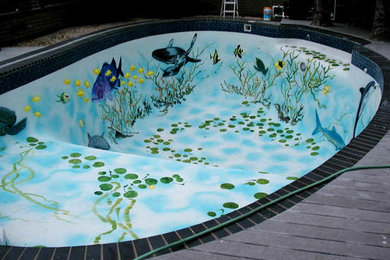 Pool - large coastal backyard custom-shaped natural pool idea in Chicago with decking