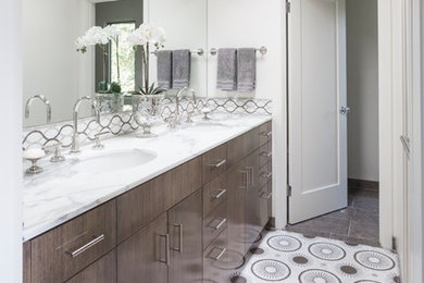 Inspiration for a transitional master multicolored floor corner shower remodel in Santa Barbara with flat-panel cabinets, dark wood cabinets, white walls, an undermount sink, marble countertops and a hinged shower door