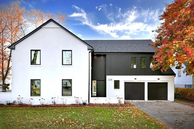 Inspiration for a large contemporary multicolored two-story stucco exterior home remodel in Chicago with a shingle roof and a black roof