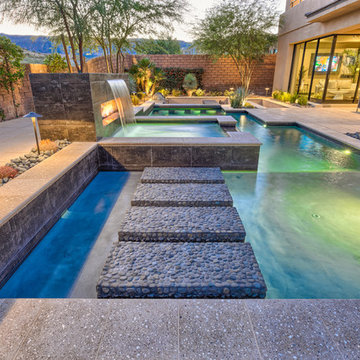 Geometric Pool with Fireplace/Water Feature, Swim Up Bar and sunken BBQ Retreat