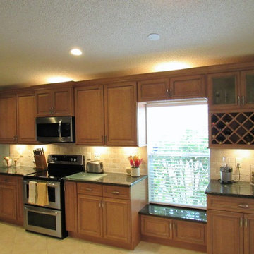 Galaxy Pecan cabinets with peacock green granite