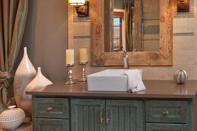 Inspiration for a mid-sized rustic master beige tile beige floor and porcelain tile bathroom remodel in Other with a vessel sink, blue cabinets, shaker cabinets, beige walls and a hinged shower door