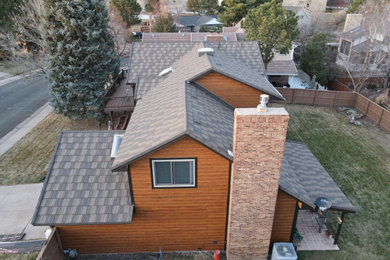 Mid-sized elegant brown two-story concrete fiberboard and clapboard gable roof photo in Denver with a metal roof and a brown roof