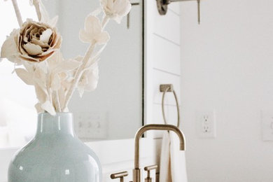 Inspiration for a country porcelain tile and gray floor bathroom remodel in Other with open cabinets, light wood cabinets, an undermount sink and white countertops