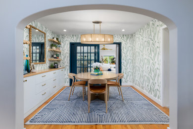 Dining room - mid-sized coastal medium tone wood floor and wallpaper dining room idea in Other with multicolored walls