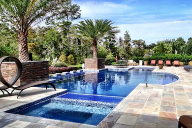 Hot tub - mid-sized tropical backyard tile and rectangular lap hot tub idea