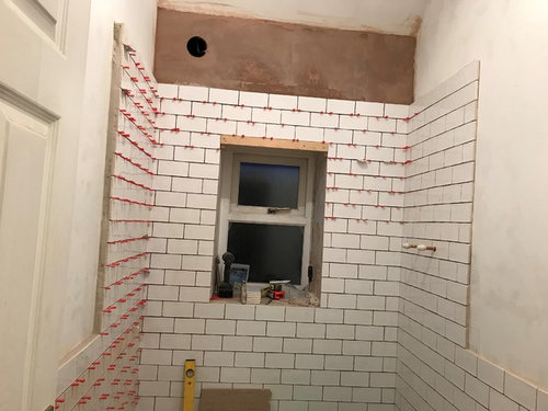 Bathroom Tiling on non plumb wall
