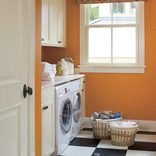 Traditional utility room in New Orleans with orange walls, multi-coloured floors and white worktops.