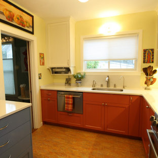 Mid-sized eclectic eat-in kitchen appliance - Eat-in kitchen - mid-sized eclectic l-shaped linoleum floor and orange floor eat-in kitchen idea in Seattle with an undermount sink, recessed-panel cabinets, red cabinets, quartz countertops, green backsplash, metal backsplash, stainless steel appliances and white countertops