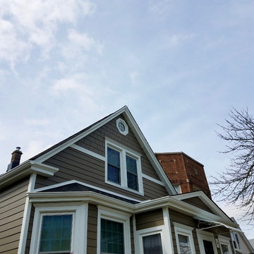 Chicago, IL Bungalow Siding Replacement with Dark Brown Siding