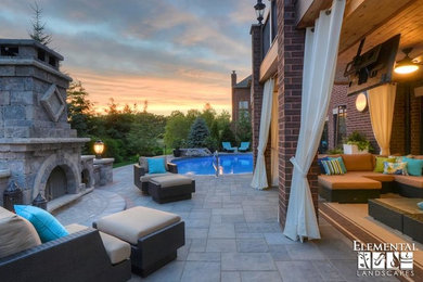 Large trendy backyard brick patio photo in Chicago