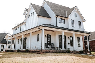 Large country white two-story house exterior idea in Chicago