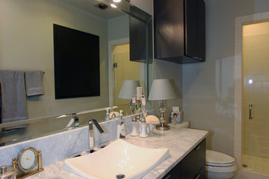 Inspiration for a small timeless 3/4 white tile and subway tile concrete floor and black floor corner shower remodel in Other with flat-panel cabinets, dark wood cabinets, white walls, granite countertops, a vessel sink and a hinged shower door
