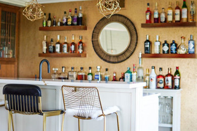 Mid-sized home bar photo in Los Angeles with white countertops
