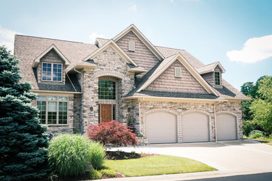 Large craftsman gray two-story mixed siding gable roof idea in Cleveland