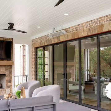 Stone Fireplace Beside the Closed NanaWall Glass Wall