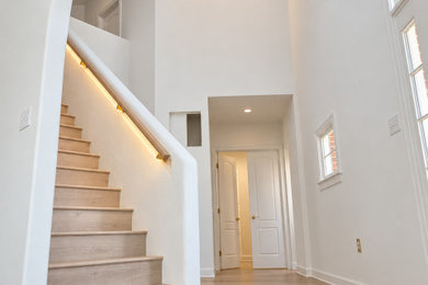 Mid-sized trendy light wood floor living room photo in DC Metro with beige walls