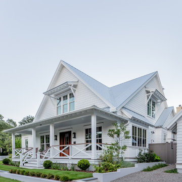 White Custom Farmhouse Style Home with Shake Shingles and Siding