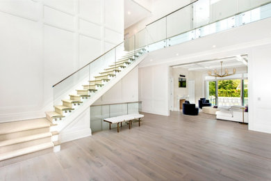 Inspiration for a huge contemporary light wood floor and beige floor entryway remodel in New York