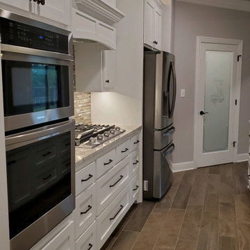 Beautiful, functional kitchen with five burner gas stove and microwave/oven comb