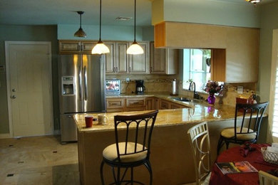 Kitchen - traditional ceramic tile kitchen idea in Orange County with light wood cabinets, concrete countertops, beige backsplash, stainless steel appliances and no island