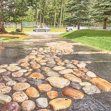 Unique Driveway Design With Rock Feature