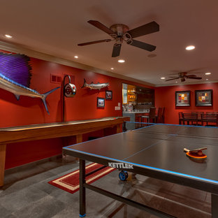 Design ideas for a medium sized contemporary fully buried basement in Omaha with red walls.