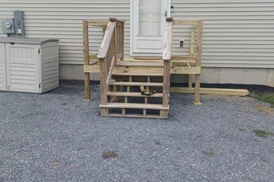 Deck - wood railing deck idea in Burlington with no cover