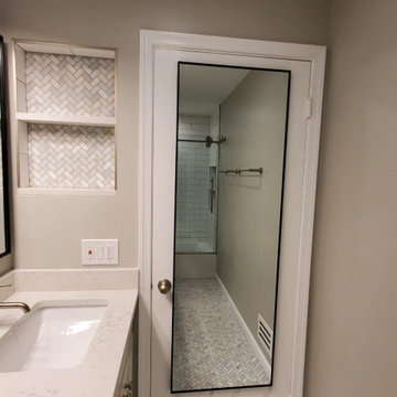 Bathroom remodeled With Double Sink, Standing Shower, Door Mirror & Flushing Toi