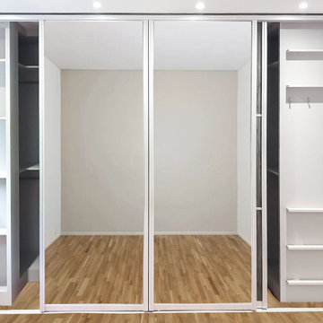 Stylish Walk-in Wardrobe with Sliding Mirror Doors in Stanmore