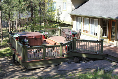 Deck - large traditional backyard deck idea in Other