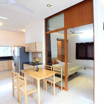 Studio apartment-Glass wall between the Bed room and the kitchen/dining to enhan