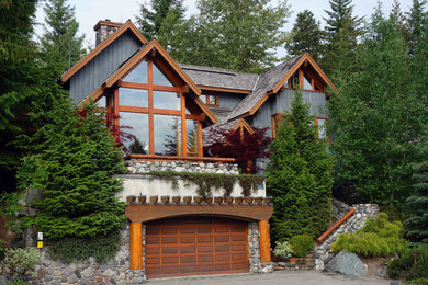Inspiration for a mid-sized rustic gray two-story wood exterior home remodel in Vancouver