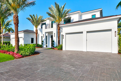 Large modern white two-story mixed siding house exterior idea in Other with a hip roof and a shingle roof
