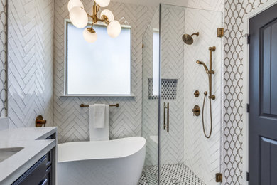 Bathroom - eclectic white tile marble floor, multicolored floor, double-sink and wallpaper bathroom idea in Houston with raised-panel cabinets, black cabinets, a one-piece toilet, white walls, an undermount sink, quartz countertops, a hinged shower door, white countertops and a built-in vanity