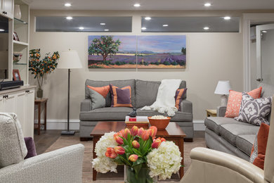Inspiration for a large transitional open concept family room in Boston with a game room, beige walls, dark hardwood floors, no fireplace, a wall-mounted tv and brown floor.